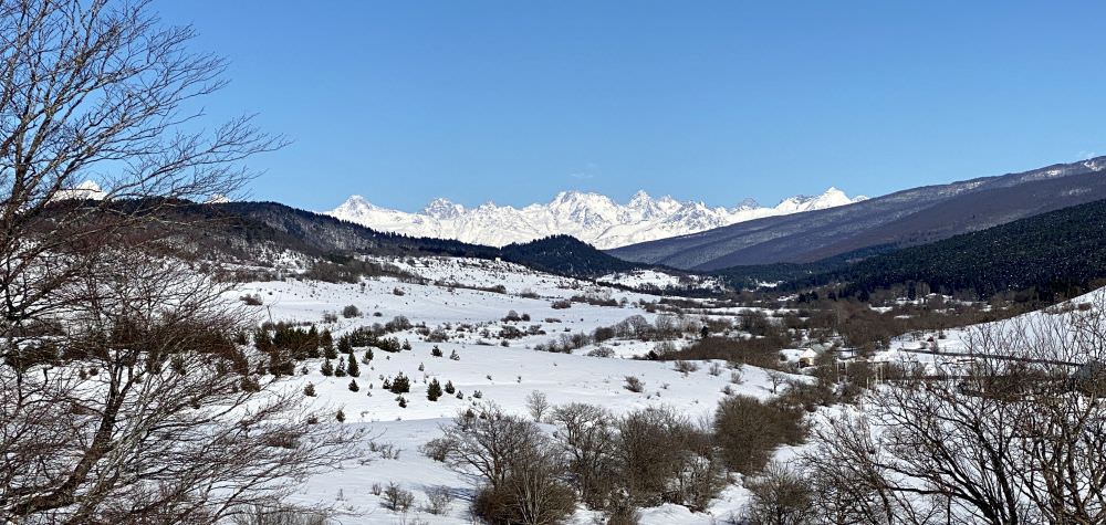 View on Greater Caucasus towards Oni from alternative path in winter]